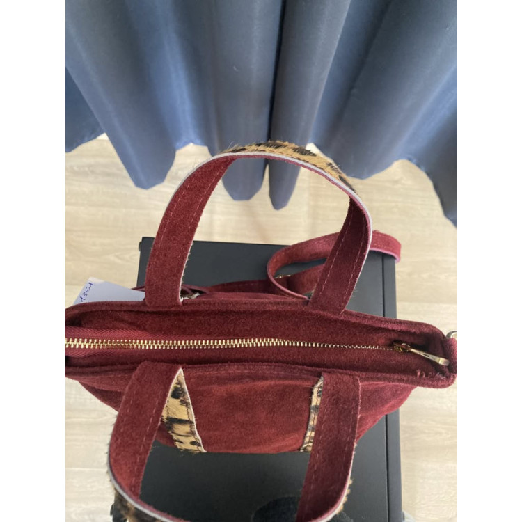 1351. Bolso piel mini asas pelo leorpardo