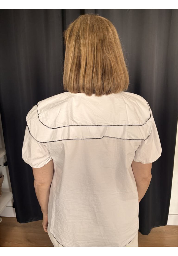 124. Blusa ribetes