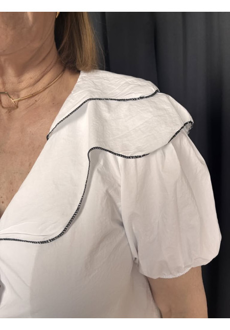 124. Blusa ribetes