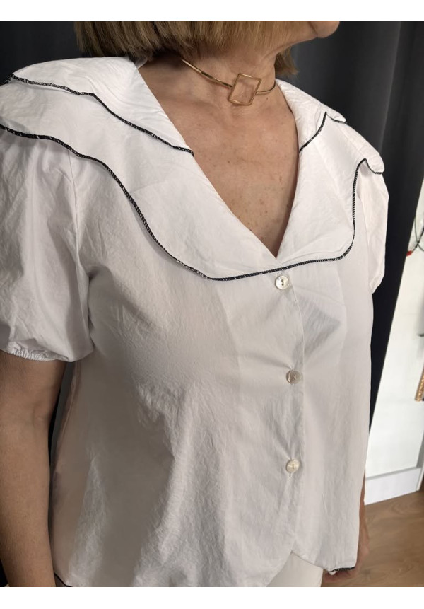 124. Blusa ribetes